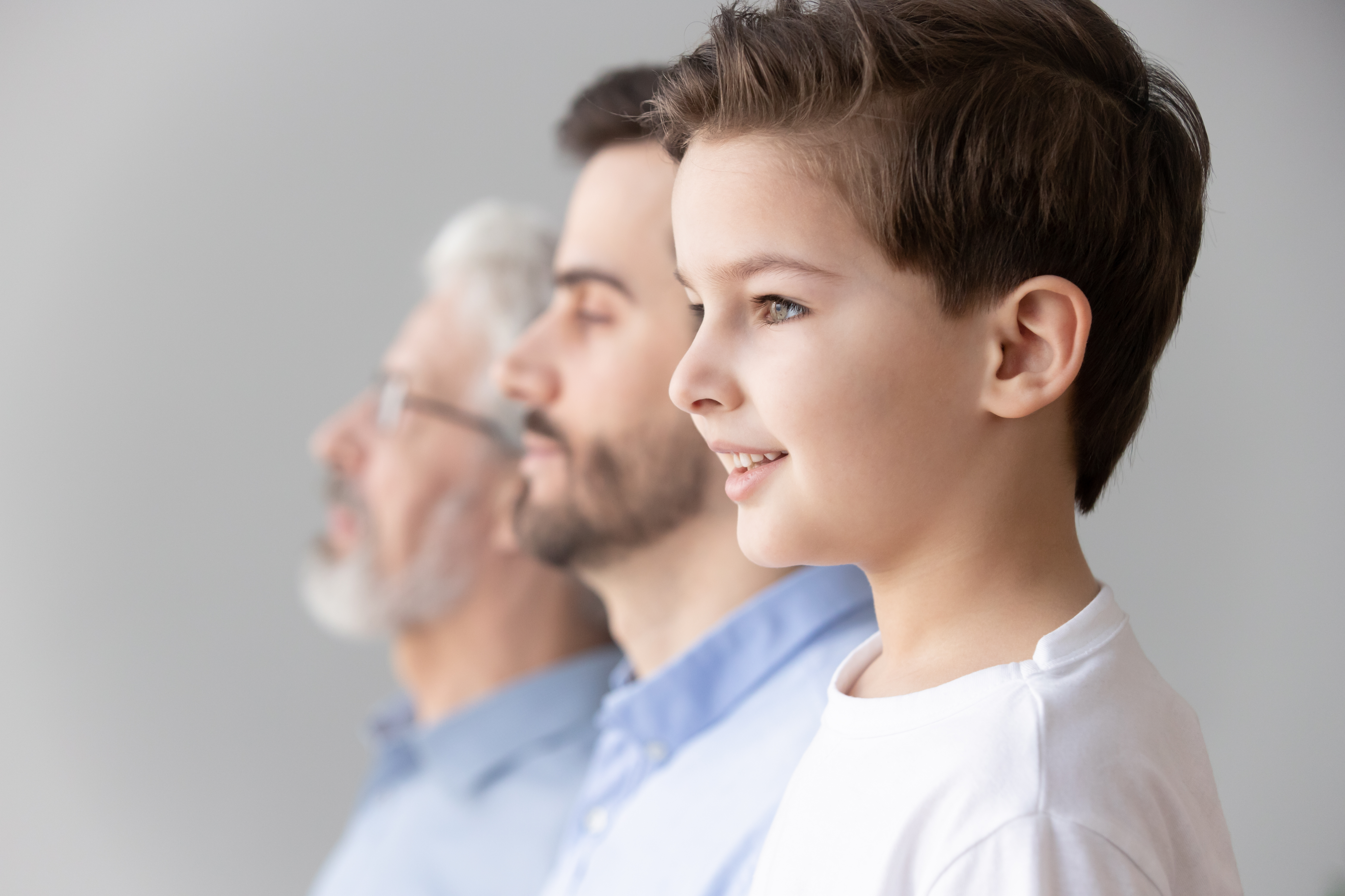 Three generations of males in a family.