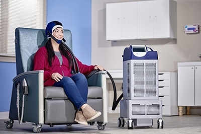 Woman in chair with DigniCap on head