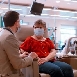 Dr. Avery with a patient in infusion room