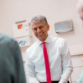 Dr. Vaziri with patients in exam room