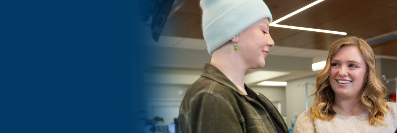 Staff member and patient looking at iPad