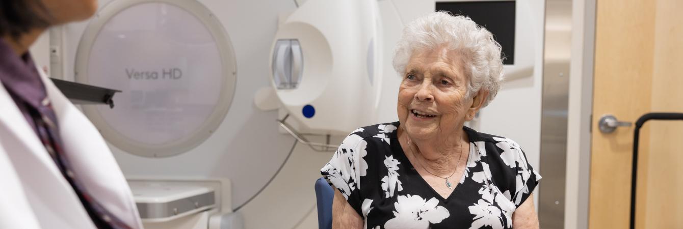 Lady sitting with doctor